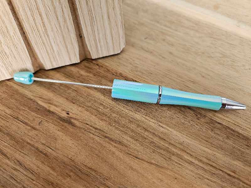 Beadable plastic pen with blac ink, color teal opal