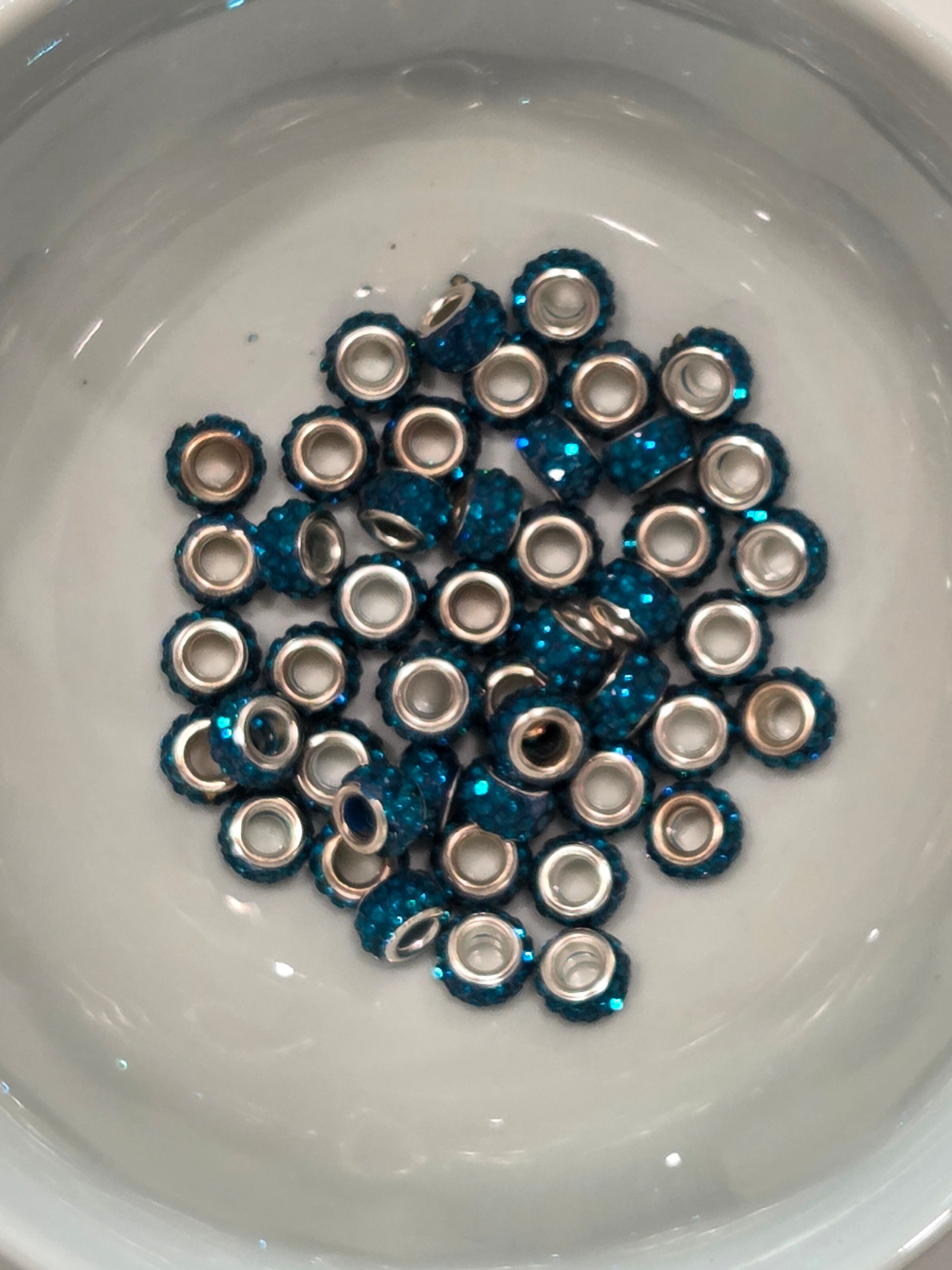 Teal colored rhinestone spacer beads